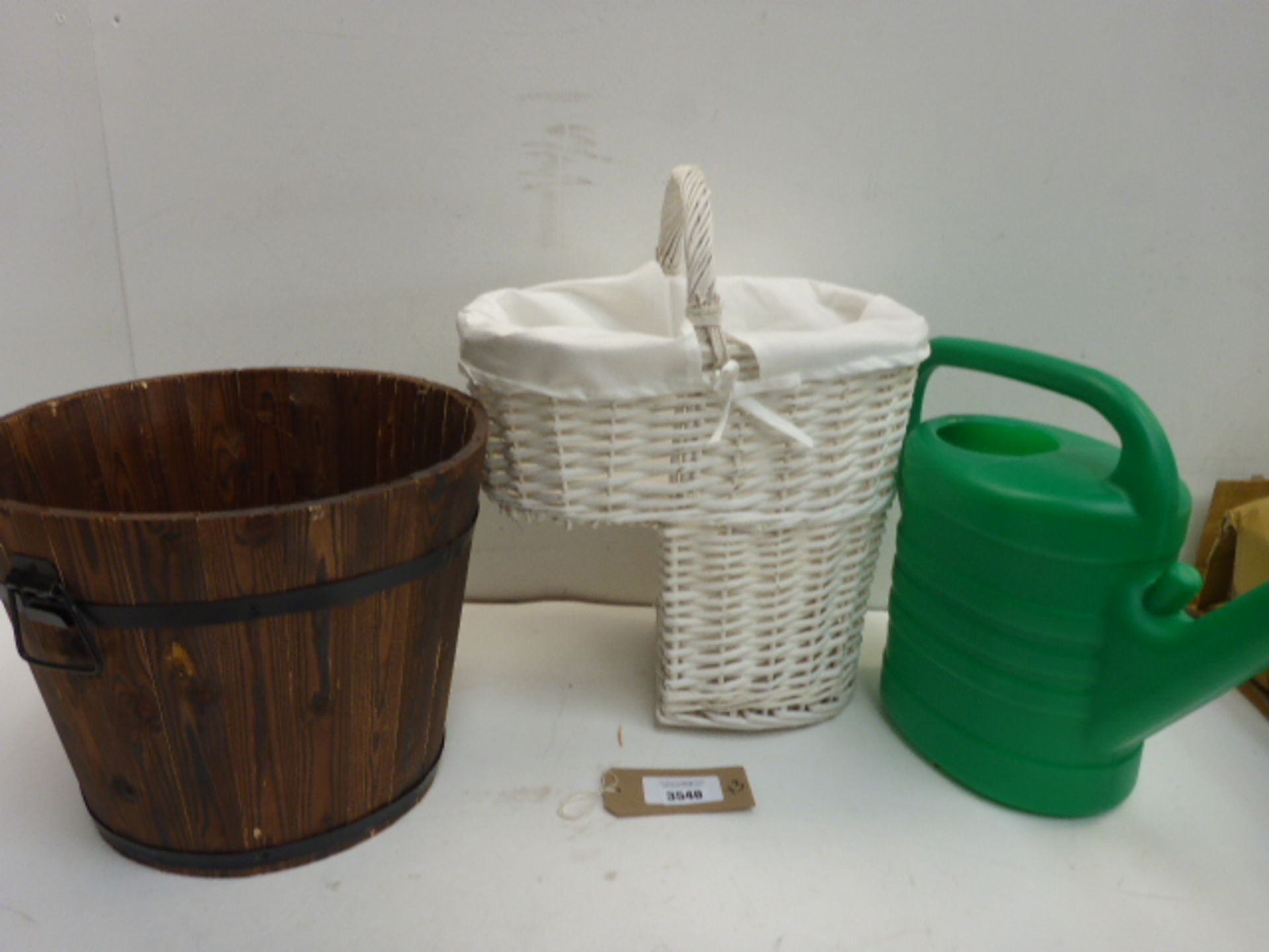 Wooden planter, watering can and wicker step basket
