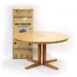 A Danish teak and crossbanded extending dining table with one boxed fitted leaf by Heltborg Mobler,