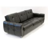 A 1970/80's black button upholstered three-seater sofa by Skippers Mobler, l.