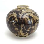 Barbara Cass, a stoneware vase of globular form decorated with brown glazes, signed, h.