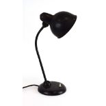 A German black enamelled adjustable desk lamp by Kaiser Idell CONDITION REPORT: EU