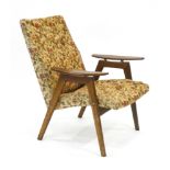A 1950/60's beech framed armchair with floral upholstery *Sold subject to our soft furnishings