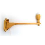 A Swedish beech wall light on a straight swing arm by Carl Malmsten, stamped, l.