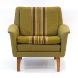 A 1960's Danish green upholstered lounge armchair with central stripes and teak legs *Sold subject