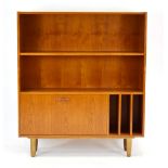 A 1960's Danish designed teak bookcase, the fixed shelf over a fall-front a LP storage,