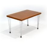 A 1970's teak and crossbanded occasional table on hairpin legs,