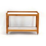 Robert Heritage for Archie Shine, a teak and laminate trolley, w.