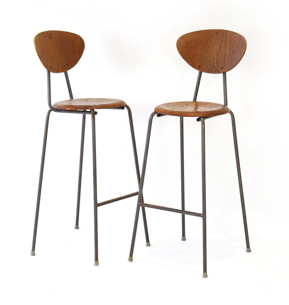 A pair of 1950/60's teak 'Dot'-style stools with matching back rests on tubular legs