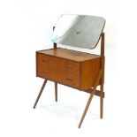 A 1960's teak dressing chest, the adjustable mirror over two drawers with integral handles, w.