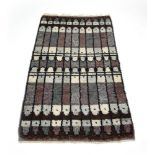 A brown and grey geometric woolen rug,