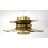 A large brass finished ceiling light with an orange inner section CONDITION REPORT: