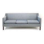 A 1960/70's Danish-designed blue fabric three-seater sofa on square straight legs, l.