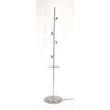 An aluminium standard lamp with four spot fittings and a conical wicker shade (the shade was