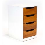 A 1960's filing pedestal, the white exterior housing four ply drawers, w.