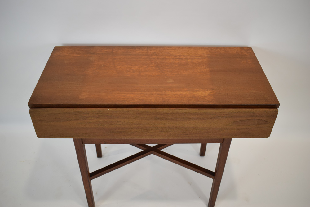 A 1970's teak console table with a single drawer, on square legs joined by a cross stretcher, w. - Image 2 of 3