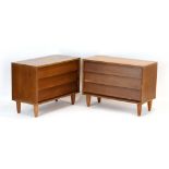 A pair of 1970's teak three-drawer chests, on later circular legs, w.