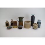 A group of pottery including an Isle of Arran vase, a Conwy vase, a Moblach pot, a stoneware jug,