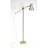 A 1970's standard lamp with an aluminium shafe on an adjustable neck and shaft CONDITION