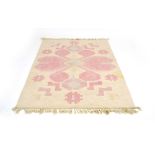 A Swedish cream and pink rolakan flatweave rug,