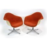 A pair of 1960's tub chairs in the manner of Charles & Ray Eames,