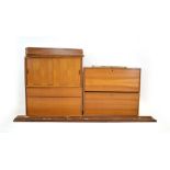 A 1960's Danish teak modular shelving system including a cabinet with two sliding doors,