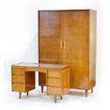 A 1960's walnut and sycamore enriched bedroom suite by Bath Cabinetmakers, No.