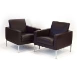 A pair of Walter Knoll brown leather club armchairs with brushed aluminium legs,