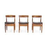 A set of three 1960/70's Danish teak bar back dining chairs with black vinyl upholstery