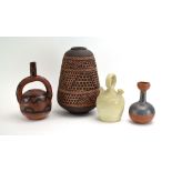 A group of Tribal-type pottery including a baluster-shaped vase with incised shapes, marked A, h.