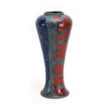 A Cobridge Toneware stoneware vase, the ground with red, blue and metallic glazes, marked PAS, KR,
