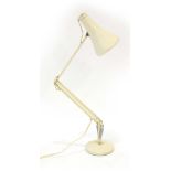 An Anglepoise cream enamelled adjustable desk lamp CONDITION REPORT: Working order