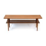 A 1960's teak and crossbanded two-tier occasional table on circular tapering legs, w.