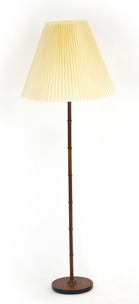 A 1960/70's turned teak standard lamp with a pleated shade CONDITION REPORT: Leads