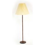 A 1960/70's turned teak standard lamp with a pleated shade CONDITION REPORT: Leads