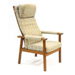 A 1970's Danish oak framed and upholstered armchair on square straight legs