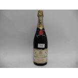 An old bottle of Moet & Chandon Vintage 1964 Dry Imperial Champagne