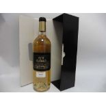 A bottle of Chateau Petit Guiraud 2013 Sauternes with box