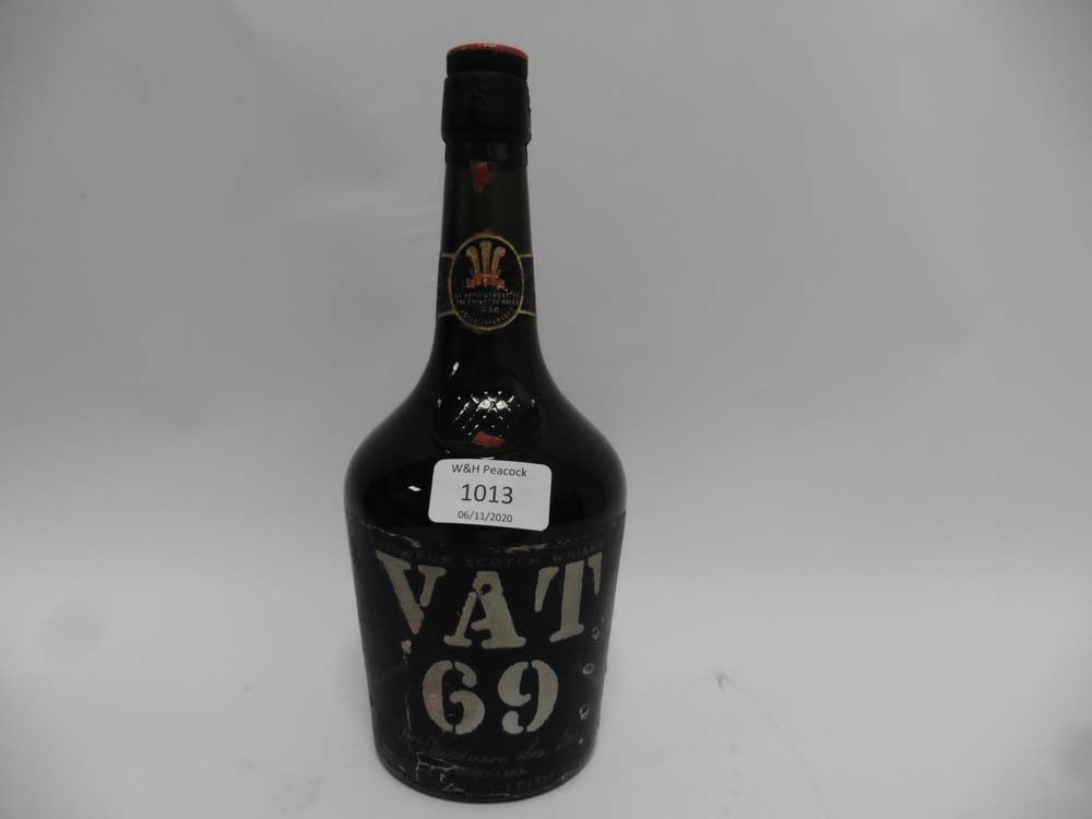 An old bottle of VAT 69 Liqueur Scotch Whisky by Sanderson & Son ltd bearing label By Appointment