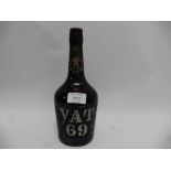 An old bottle of VAT 69 Liqueur Scotch Whisky by Sanderson & Son ltd bearing label By Appointment