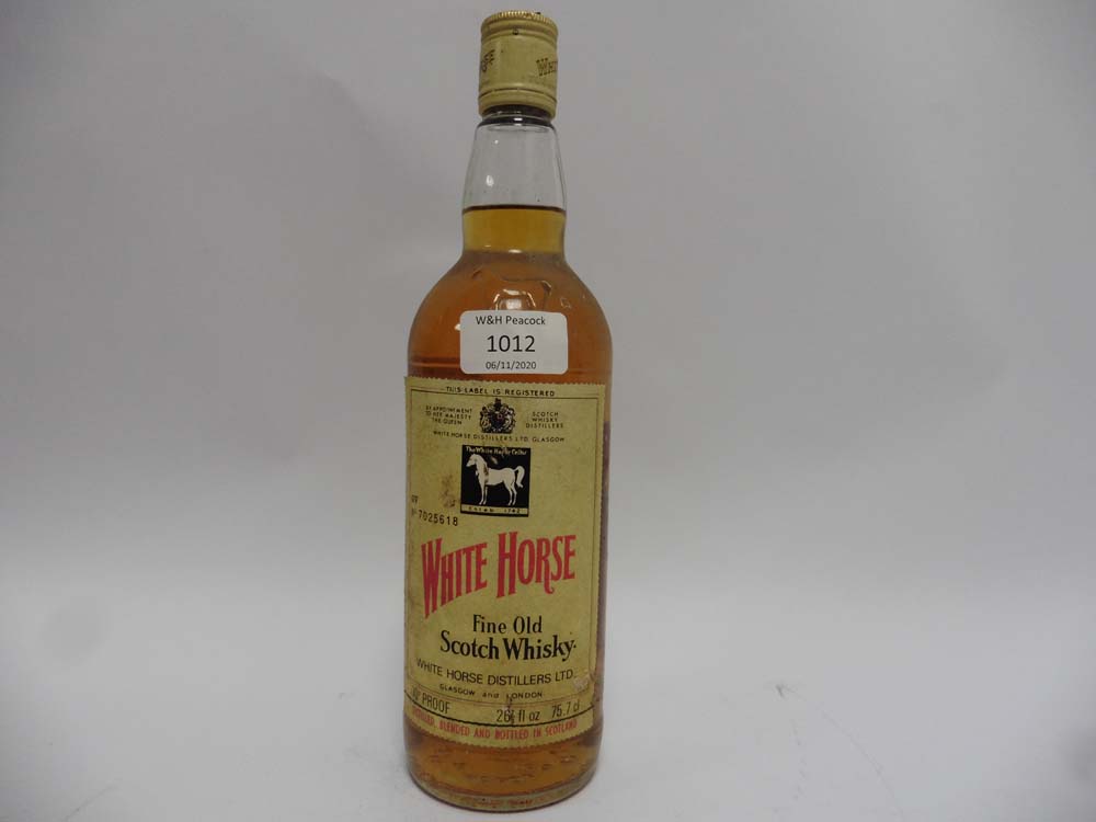 An old bottle of White Horse Fine Old Whisky circa 1970's 70proof 26 2/3 fl oz 75.