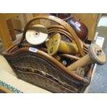 Wicker and bamboo basket containing wooden reels