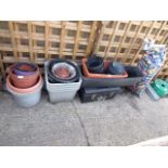 Selection of plastic garden pots, toolbox and bag containing sun bed parts