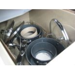 Box containing Starfrit The Rock cooking pans