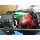 Box containing grinder, spotlight and other garage items
