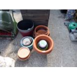 Selection of various terracotta and plastic garden pots