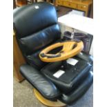 Black leatherette upholstered swivel office lounger chair with matching stool