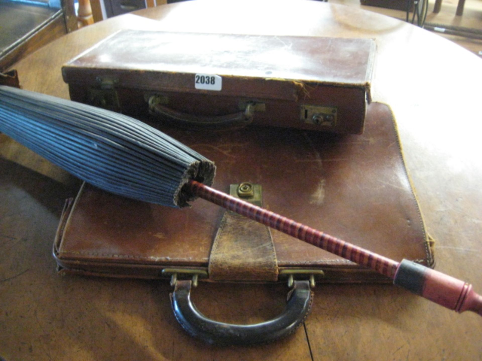 Vintage parasol, leather pistol case and 1 other leather bag