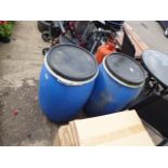 2 blue plastic barrels