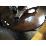 Low circular table on claw feet