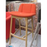 Kitchen stool with orange upholstered seat